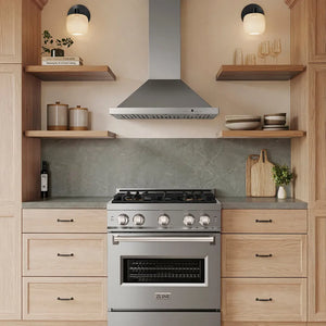 A stainless steel ZLINE gas range and matching ZLINE 30 in. Convertible Vent Wall Mount Range Hood in Stainless Steel (KB-30) installed in a modern kitchen with light wood cabinets, open shelves, and a gray stone backsplash.