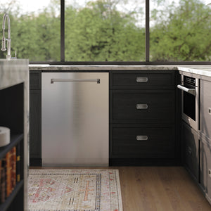 Modern kitchen with black cabinets, ZLINE 24 in. Tallac Series 3rd Rack Tall Tub Dishwasher in Stainless Steel, 51dBa (DWV-304-24), and a view of greenery outside.