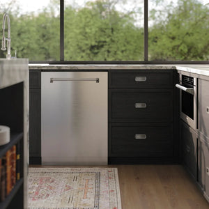 ZLINE 24 in. Tallac Series 3rd Rack Dishwasher with Auto Door Open Drying, 51dBa, Stainless Steel Panel (DWV-304-24) in a kitchen with black cabinets, stainless steel appliances, and a view of greenery outside.