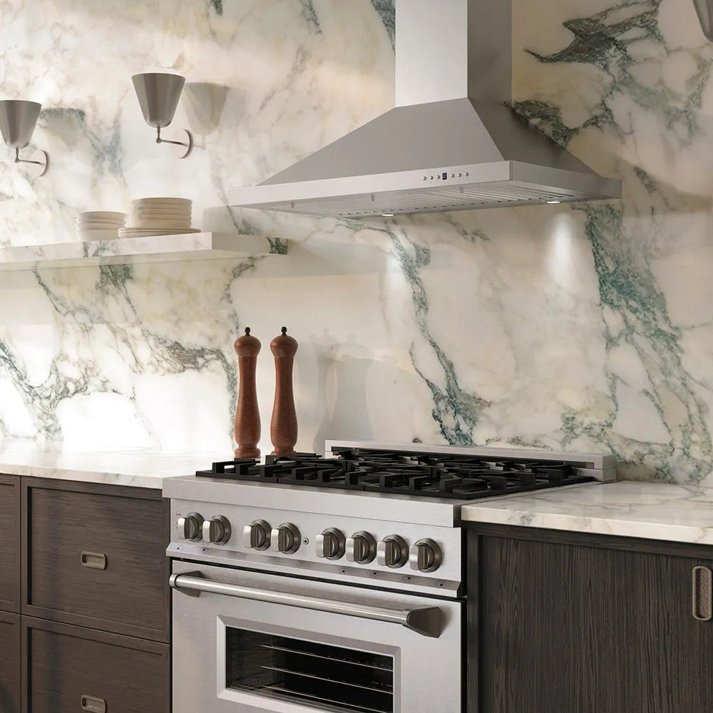 Luxury kitchen with ZLINE 36 in. Convertible Vent Wall Mount Range Hood in Stainless Steel (KB-36), stainless steel stove, and marble backsplash