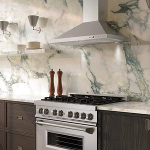Luxury kitchen with ZLINE 36 in. Convertible Vent Wall Mount Range Hood in Stainless Steel (KB-36), stainless steel stove, and marble backsplash