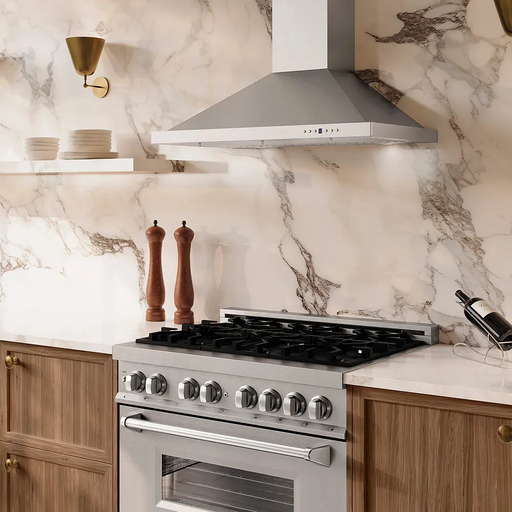 Modern kitchen with ZLINE 36 in. Convertible Vent Wall Mount Range Hood in Stainless Steel (KB-36), stainless steel stove, and marble backsplash