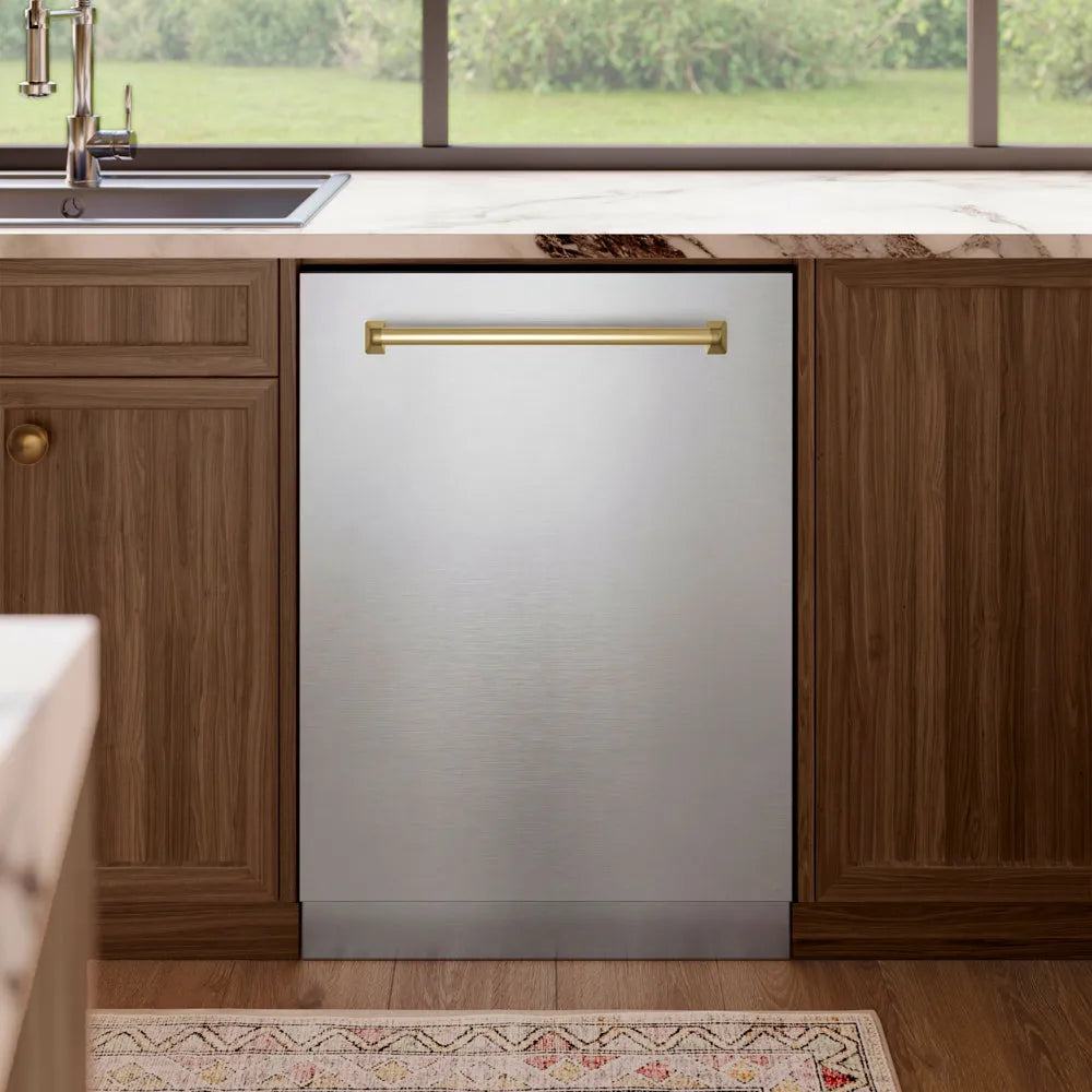 ZLINE Autograph Edition 24 in. Tallac Series 3rd Rack Dishwasher with Auto Door Open Drying, 51dBa, Stainless Steel Panel with Champagne Bronze Handle (DWVZ-304-24-CB) in a kitchen with wooden cabinets and a window view.