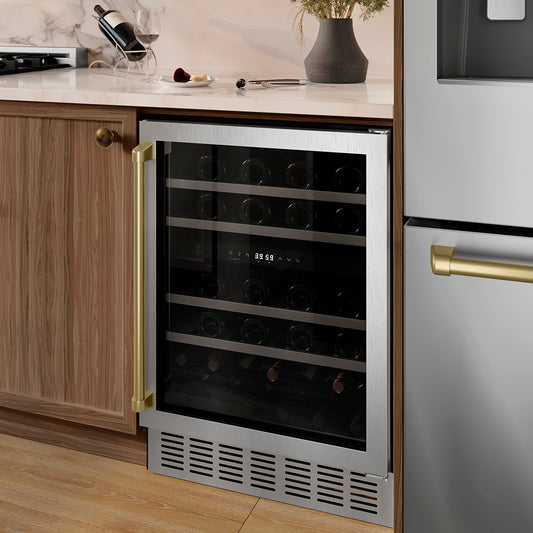 ZLINE Autograph Edition 24 in. Monument Dual Zone 44 Bottle Wine Cooler in Stainless Steel with Champagne Bronze Accents (RWVZ-UD-24-CB) in a kitchen setting with wooden cabinets and a countertop.