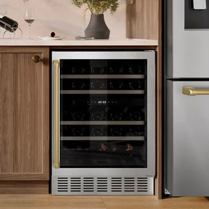 ZLINE Autograph Edition 24 in. Monument Dual Zone 44 Bottle Wine Cooler in Stainless Steel with Champagne Bronze Accents (RWVZ-UD-24-CB) in a kitchen setting with wooden cabinets and a refrigerator.