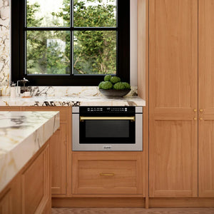 Luxury kitchen with wooden cabinets, marble countertops, and a ZLINE Autograph Edition 24 in. 1.2 cu. ft. Built-in Microwave Drawer with a Traditional Handle in Stainless Steel and Champagne Bronze Accents (MWDZ-1-H-CB)