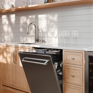 Open ZLINE 24 in. Tallac Series 3rd Rack Tall Tub Dishwasher in Stainless Steel, 51dBa (DWV-304-24) in a butler's pantry with wooden cabinets and white tiled walls.