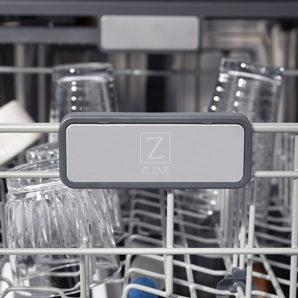 ZLINE logo inside ZLINE 24 in. Monument Series 3rd Rack Top Touch Control Dishwasher in Stainless Steel with Stainless Steel Tub, 45dBa (DWMT-304-24) with racks and dishes inside