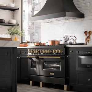 Modern kitchen with ZLINE Autograph Edition 48 in. 6.0 cu. ft. Legacy Dual Fuel Range with 7 Burner Gas Cooktop and 2 Electric Ovens in Black Stainless Steel and Champagne Bronze Accents (RABZ-48-CB), white tiled walls, and wooden utensils.