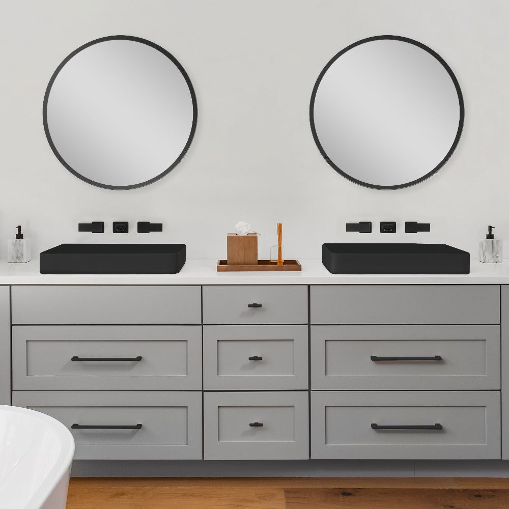 Two ZLINE Bliss Wall Mount Bath Faucet in Matte Black (BLS-BFW-MB) above a double vanity with vessel sinks.