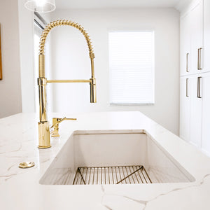 ZLINE Sierra Pull Down Spring Single Handle Kitchen Faucet in Polished Gold (SRA-KF-PG) in a white kitchen setting