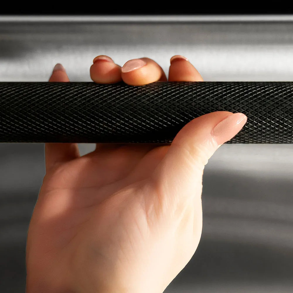 ZLINE Autograph Edition 24 in. Dishwasher Helix Handle (Set of 1) in Matte Black (DWHZ-K-MB-24) on appliance showing diamond knurled details.