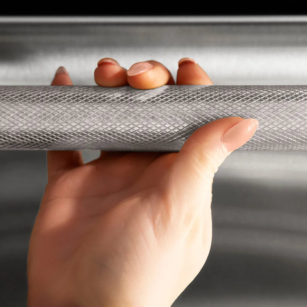 ZLINE 24 in. Dishwasher Helix Handle (Set of 1) in Stainless Steel (DWHZ-K-ST-24) on appliance showing diamond knurled details.