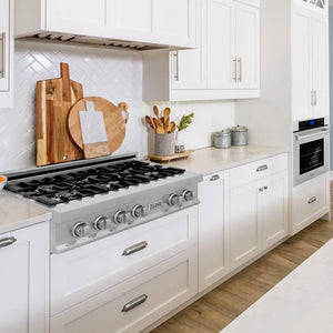 ZLINE Kitchen Package with 36 in. Stainless Steel Rangetop and 30 in. Single Wall Oven (2KP-RTAWS36) in a cottage-style kitchen.