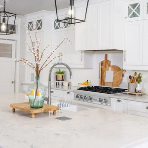ZLINE 36 in. Legacy Gas Rangetop with 6 Burners and Porcelain Cooktop in Stainless Steel (RT36) in a farmhouse kitchen with white cabinets, marble countertops, and decorative elements.