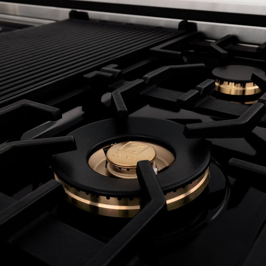 Brass burners and griddle close up on ZLINE Autograph Edition 48 in. Porcelain Rangetop with 7 Gas Burners in Stainless Steel with Champagne Bronze Accents (RTZ-48-CB)