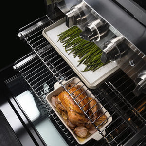 ZLINE 36 in. 5.2 cu. ft. Marino Gas Range with 6 Burner DuoPro™ Cooktop and Convection Gas Oven in Stainless Steel (PMGR36) close-up, oven racks, one holding a tray of green asparagus on a white liner and the other holding a roasted chicken in a white ceramic dish, shown from a high-angle view.