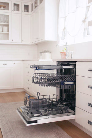 Open ZLINE 24 in. Tallac Series 3rd Rack Tall Tub Dishwasher in Custom Panel Ready with Stainless Steel Tub, 51dBa (DWV-24) in a farmhouse kitchen with white cabinets.