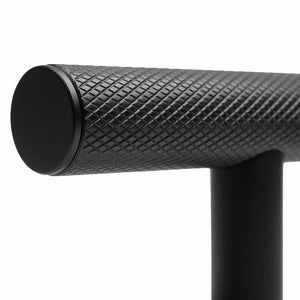 ZLINE Autograph Edition 48 in. Wall-Mount Range Hood Helix Handle (Set of 1) in Matte Black (RHHZ-K-MB-48) close-up detail, showing textured finish with knurling.