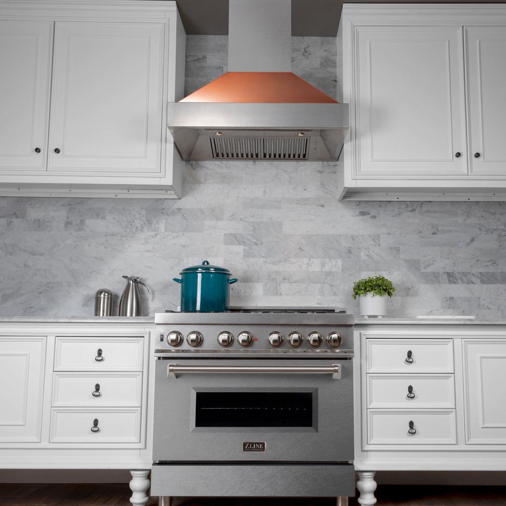 ZLINE 36 in. Ducted Satin Stainless Steel Wall Mount Range Hood with Copper Shell (8654C-36) in a luxury kitchen.