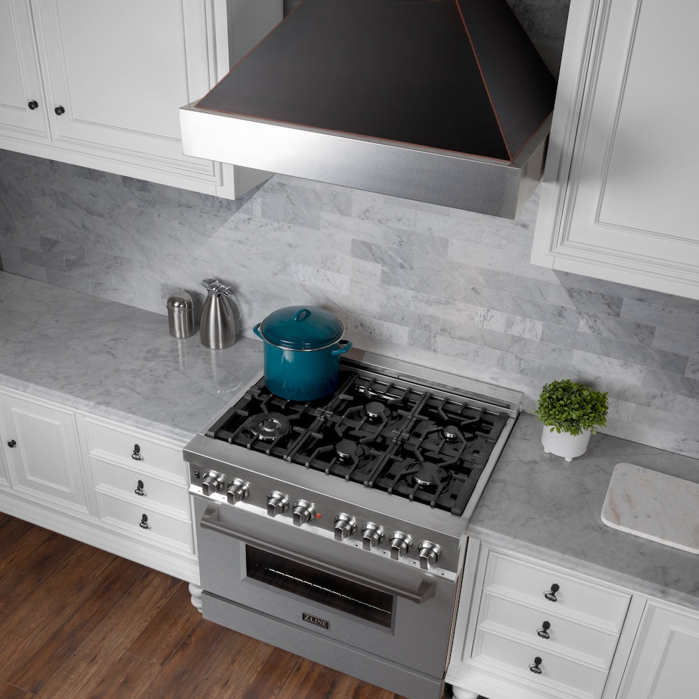 ZLINE 30 in. Ducted Satin Stainless Steel Wall Mount Range Hood with Oil Rubbed Bronze Shell (8654ORB-30) in a luxury kitchen.