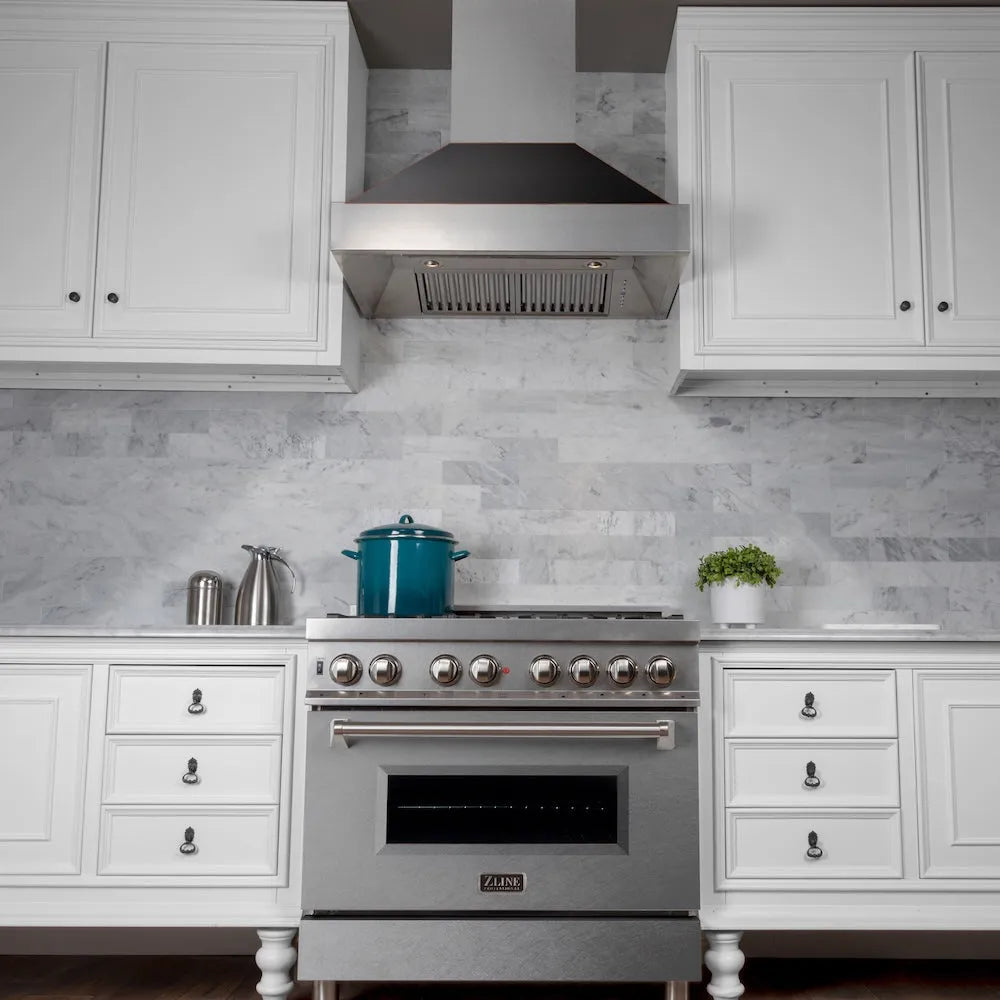 ZLINE 36 in. Ducted Satin Stainless Steel Wall Mount Range Hood with Oil Rubbed Bronze Shell (8654ORB-36) in a luxury kitchen.