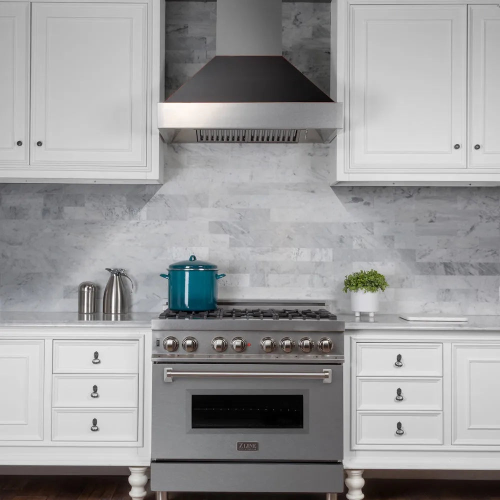 ZLINE 36 in. Ducted Satin Stainless Steel Wall Mount Range Hood with Oil Rubbed Bronze Shell (8654ORB-36) in a luxury kitchen.