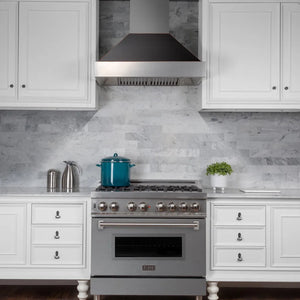 ZLINE 36 in. Ducted Satin Stainless Steel Wall Mount Range Hood with Oil Rubbed Bronze Shell (8654ORB-36) in a luxury kitchen.