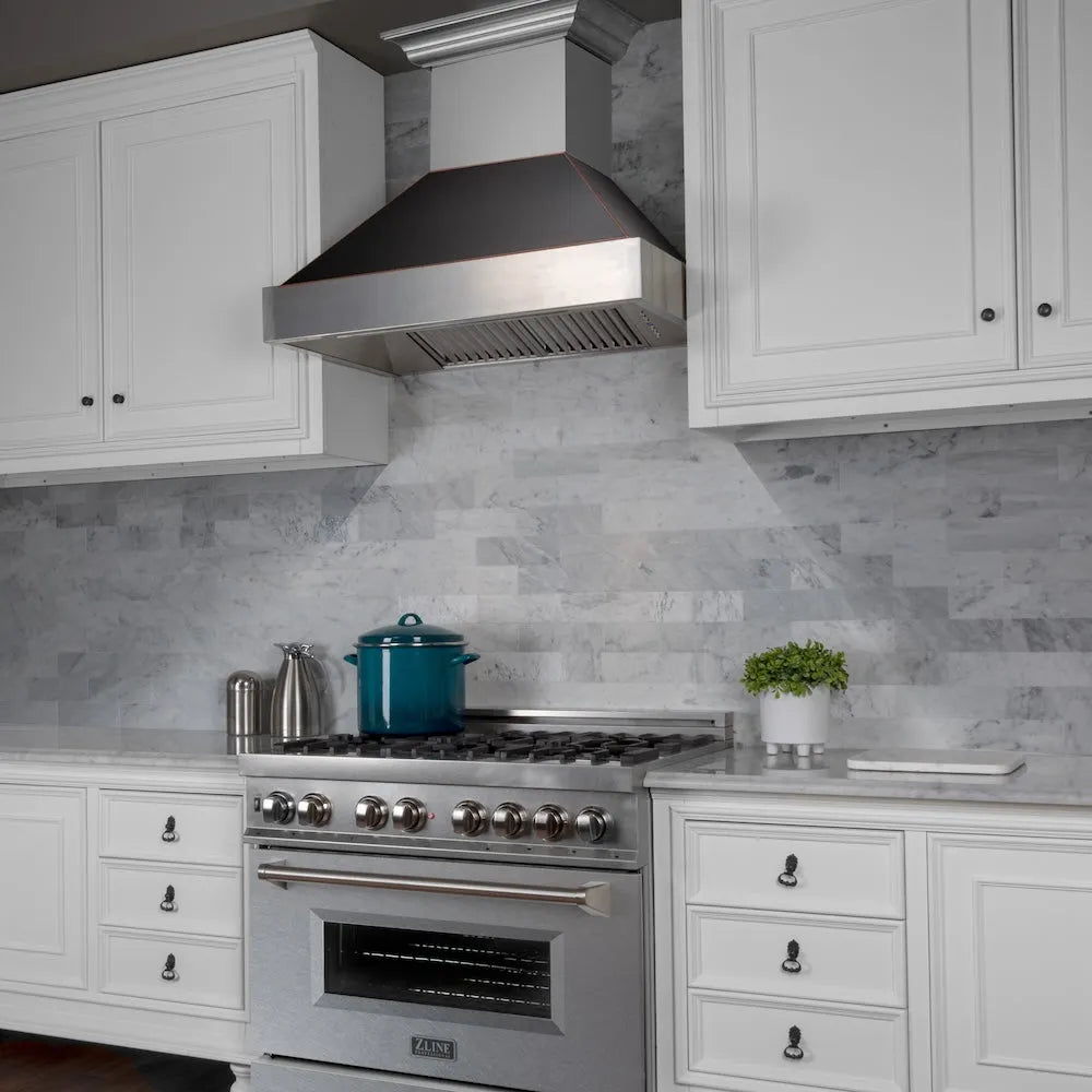 ZLINE 36 in. Ducted Satin Stainless Steel Wall Mount Range Hood with Oil Rubbed Bronze Shell (8654ORB-36) in a luxury kitchen.