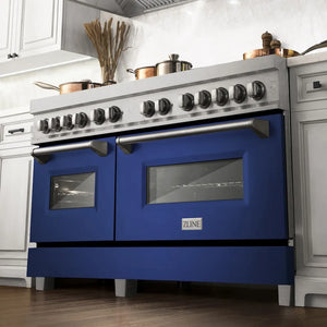 ZLINE 60 in. 7.4 cu. ft. Legacy Dual Fuel Range with 9 Burner Gas Cooktop and 2 Electric Convection Ovens in Satin Stainless Steel and Blue Matte Doors (RAS-BM-60) below, in a luxury farmhouse-style kitchen.