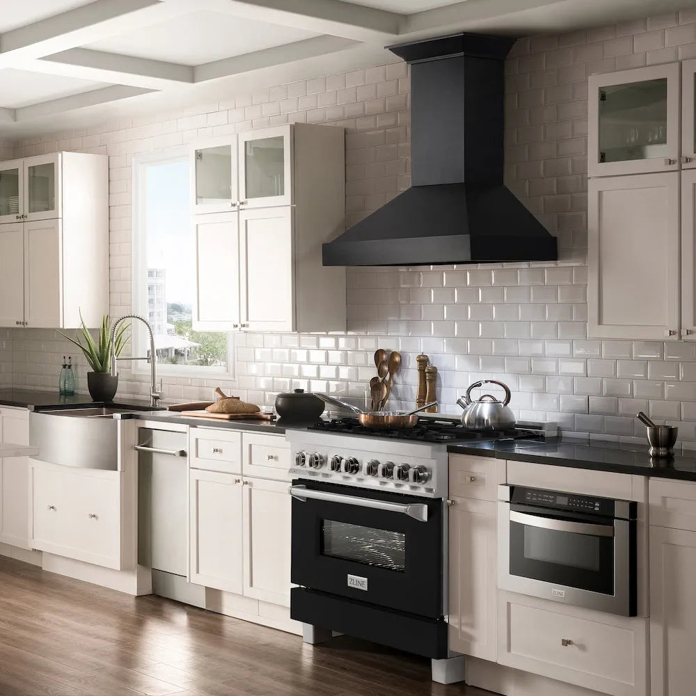 Farmhouse kitchen with ZLINE 36 in. 4.6 cu. ft. Legacy Dual Fuel Range with 6 Burner Gas Cooktop and Electric Convection Oven in Satin Stainless Steel and Black Matte Door (RAS-BLM-36), range hood, white cabinets, and tiled backsplash.