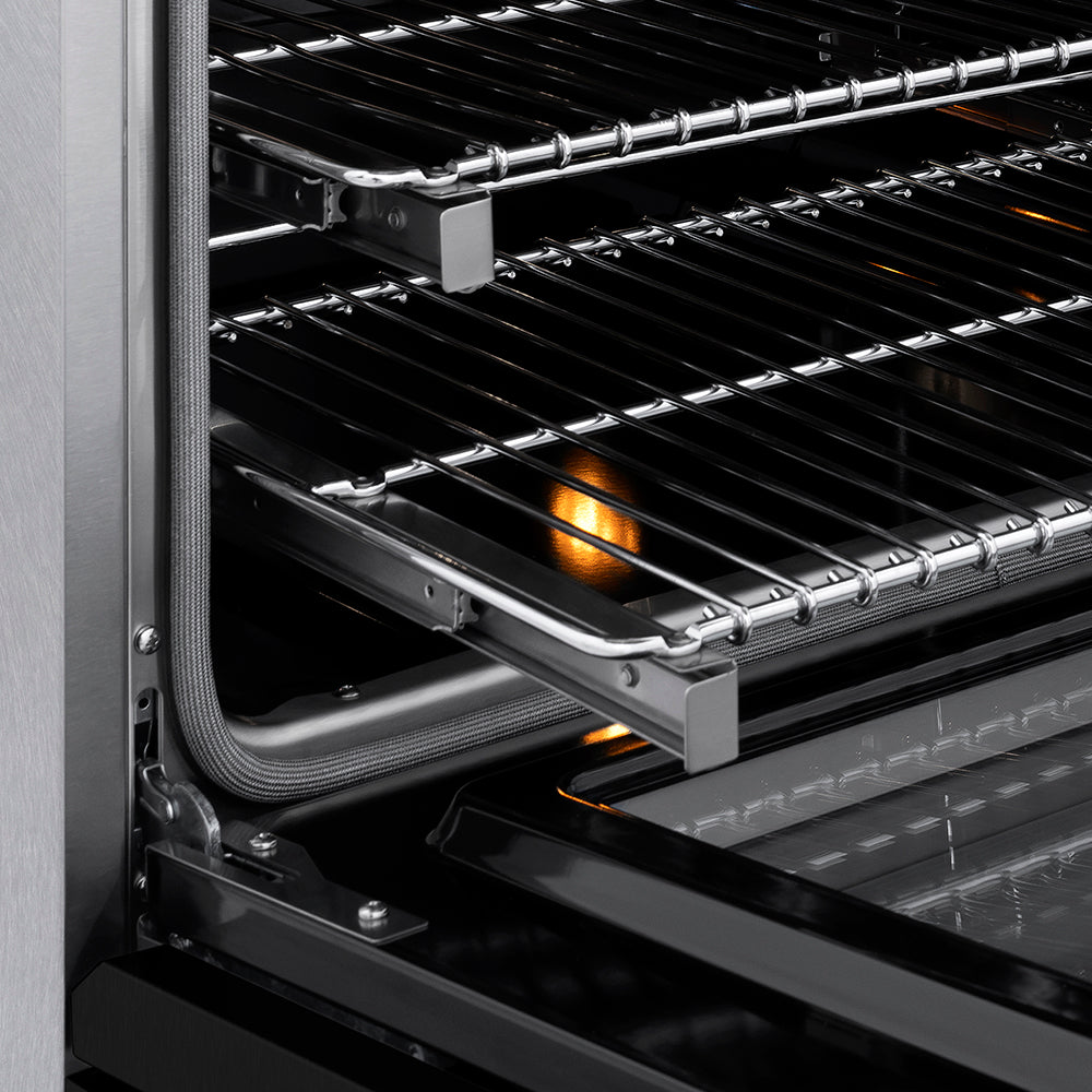 ZLINE 36 in. 5.2 cu. ft. Paramount Induction Range with 5 Element Cooktop and Electric Convection Oven in Satin Stainless Steel with Black Matte Door (SINRS-BLM-36) close-up, oven open showing SmoothGlide racks and interior components.