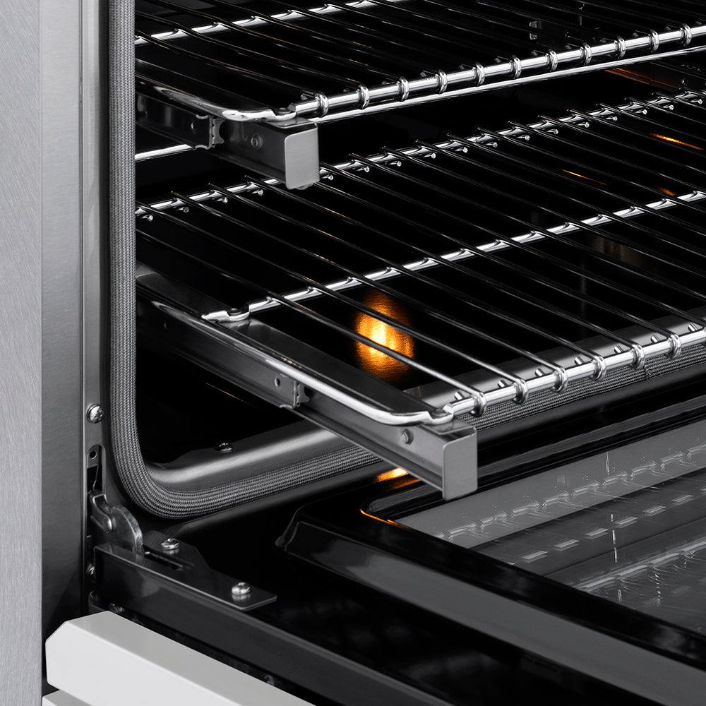 ZLINE Autograph Edition 30 in. 4.2 cu. ft. Paramount Induction Range with 4 Element Cooktop and Electric Convection Oven in Satin Stainless Steel with White Matte Door and Champagne Bronze Accents (SINRSZ-WM-30-CB) close-up, oven open showing SmoothGlide racks and interior components.