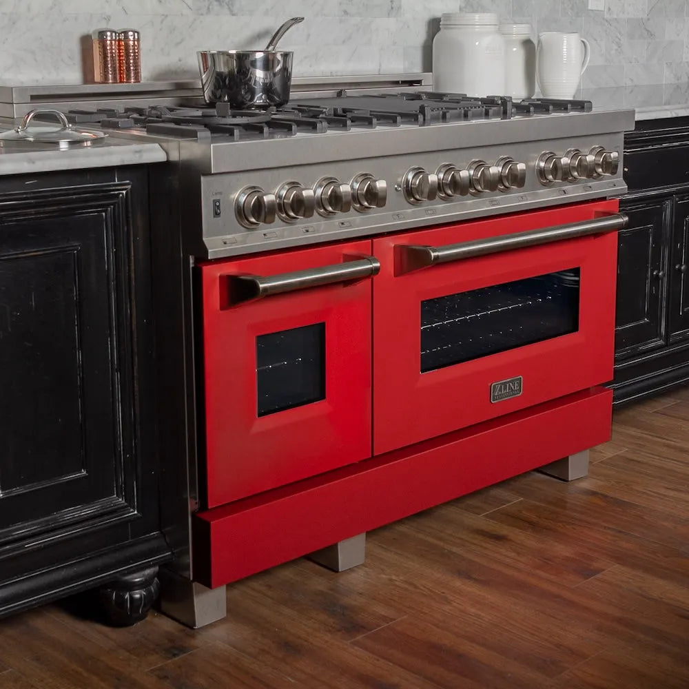 ZLINE 48 in. 6.0 cu. ft. Legacy Dual Fuel Range with 7 Burner Gas Cooktop and 2 Electric Ovens in Satin Stainless Steel and Red Matte Doors (RAS-RM-48) in a luxury kitchen.