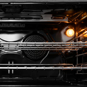 ZLINE 36 in. 4.6 cu. ft. Legacy Dual Fuel Range with 6 Burner Gas Cooktop and Electric Convection Oven in Stainless Steel (RA36) close-up of oven interior with glowing light bulb