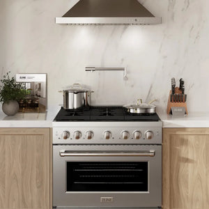 ZLINE 36 in. 5.2 cu. ft. Paramount Gas Range with 6 Burner Cooktop and Convection Gas Oven in Stainless Steel (SGR36) in a modern kitchen with marble backsplash and wooden cabinets.