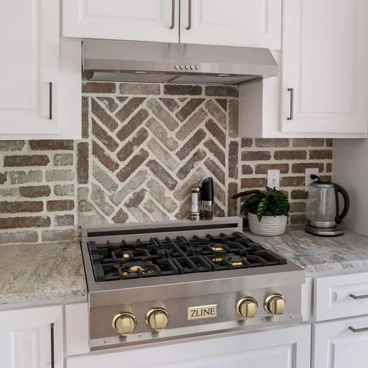 ZLINE Autograph Edition 30 in. Legacy Gas Rangetop with 4 Burners and Porcelain Cooktop in Stainless Steel with Polished Gold Accents (RTZ-30-G) lifestyle, in a luxury kitchen.