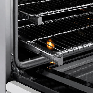 ZLINE Autograph Edition 36 in. 5.2 cu. ft. Paramount Induction Range with 5 Element Cooktop and Electric Convection Oven in Stainless Steel with White Matte Door and Matte Black Accents (SINRZ-WM-36-MB) close-up, oven open showing SmoothGlide racks and interior components.