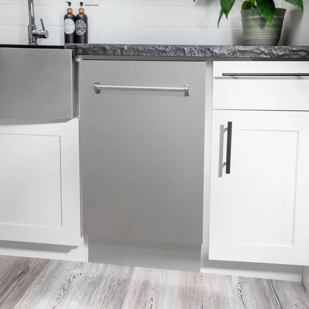 ZLINE 18 in. Tallac Series 3rd Rack Dishwasher with Auto Door Open Drying, 51dBa, Stainless Steel Panel (DWV-304-18) in a modern kitchen with white cabinets and a gray countertop.