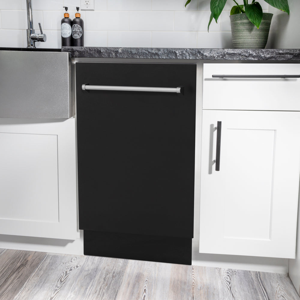 ZLINE 18 in. Tallac Series 3rd Rack Dishwasher with Auto Door Open Drying, 51dBa, Black Matte Panel (DWV-BLM-18) in a modern kitchen with white cabinets and a gray countertop.