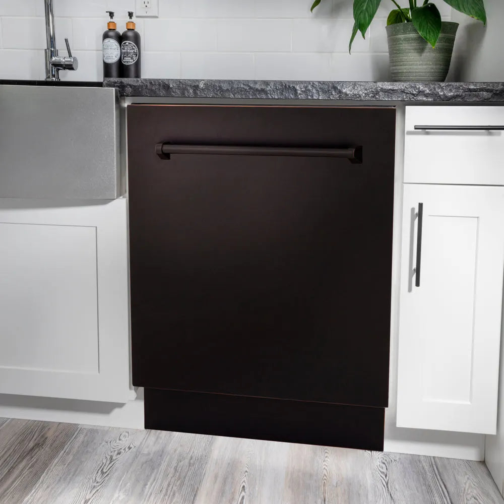 ZLINE 24 in. Tallac Series 3rd Rack Dishwasher with Auto Door Open Drying, 51dBa, Oil-Rubbed Bronze Panel (DWV-ORB-24) in a modern kitchen with white cabinets and a gray countertop.