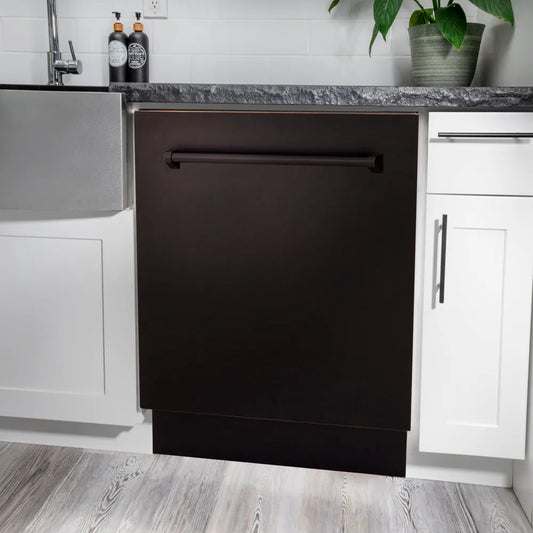 ZLINE 24 in. Tallac Series 3rd Rack Dishwasher with Auto Door Open Drying, 51dBa, Oil-Rubbed Bronze Panel (DWV-ORB-24) in a modern kitchen with white cabinets and a gray countertop.