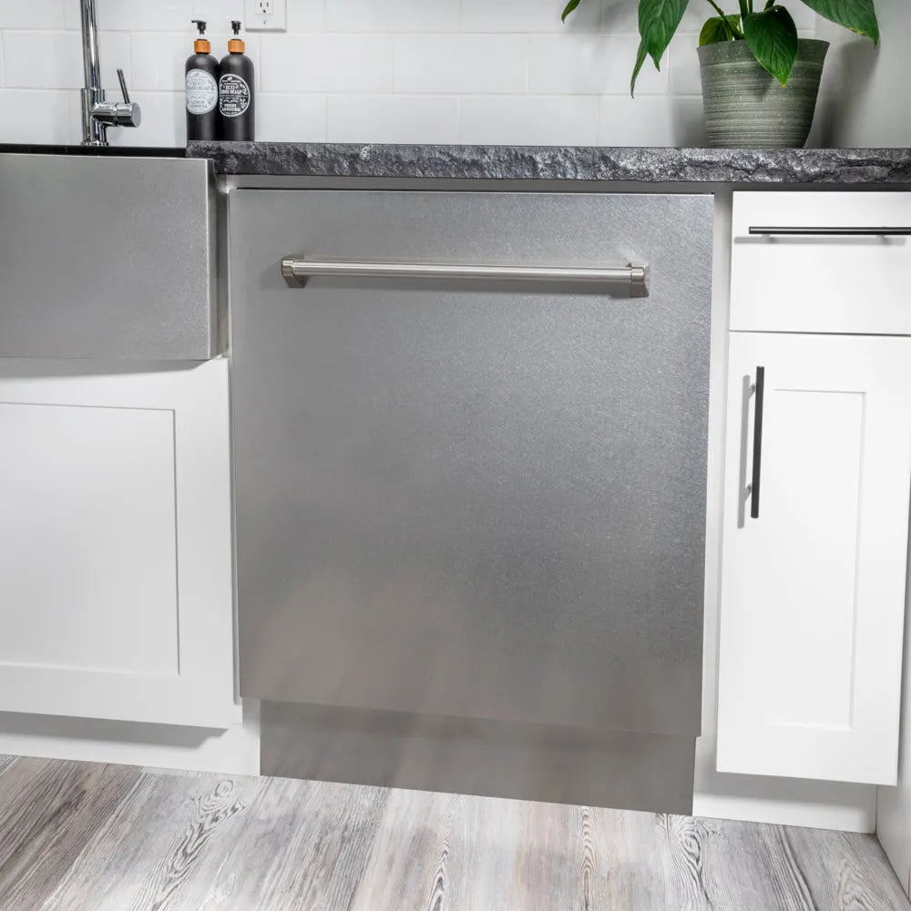ZLINE 24 in. Tallac Series 3rd Rack Dishwasher with Auto Door Open Drying, 51dBa, Satin Stainless Steel Panel (DWV-SN-24) in a modern kitchen with white cabinets and a gray countertop.