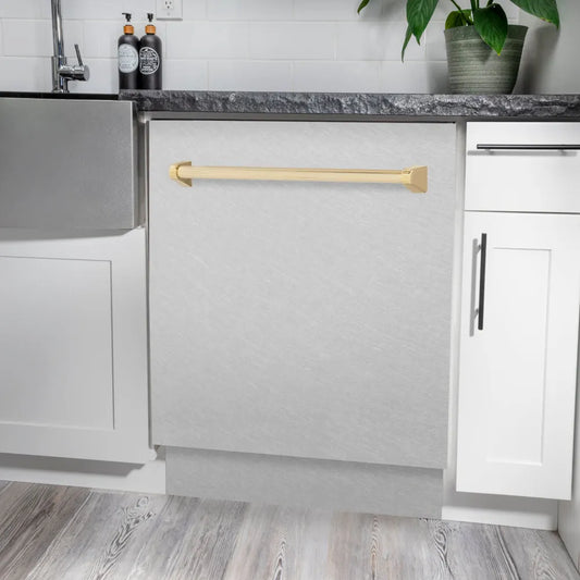ZLINE Autograph Edition 24 in. Tallac Series 3rd Rack Dishwasher with Auto Door Open Drying, 51dBa, Satin Stainless Steel Panel with Polished Gold Handle (DWVZ-SN-24-G) in a modern kitchen with white cabinets and a gray countertop.