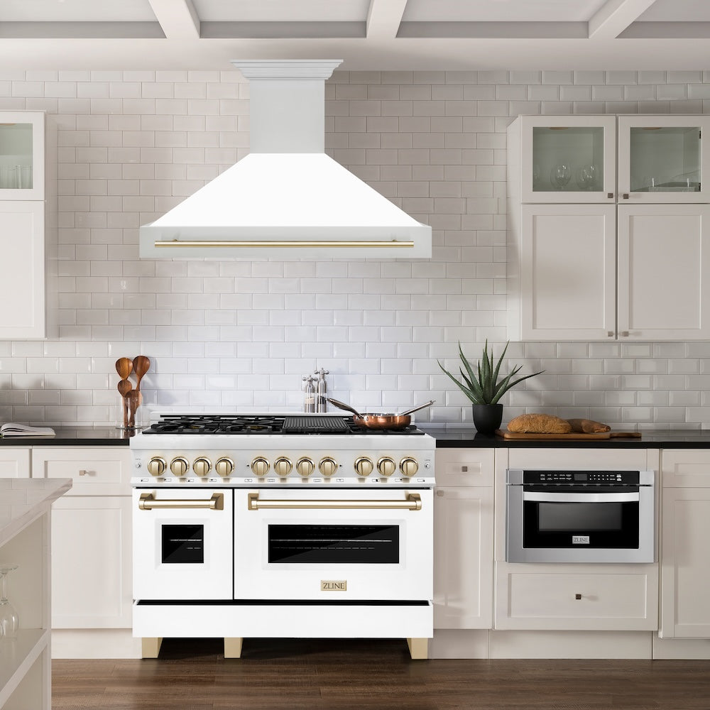 ZLINE Autograph Edition 48 in. Stainless Steel Range Hood with White Matte Shell and Polished Gold Handle (8654STZ-WM48-G) in a luxury kitchen.