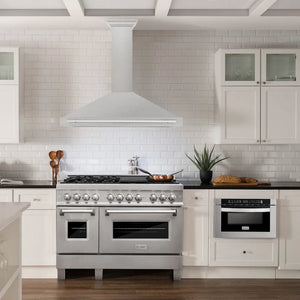 ZLINE 48 in. Convertible Satin Stainless Steel Wall Mount Range Hood with Stainless Steel Handle (KB4SNX-48) in a luxury kitchen.