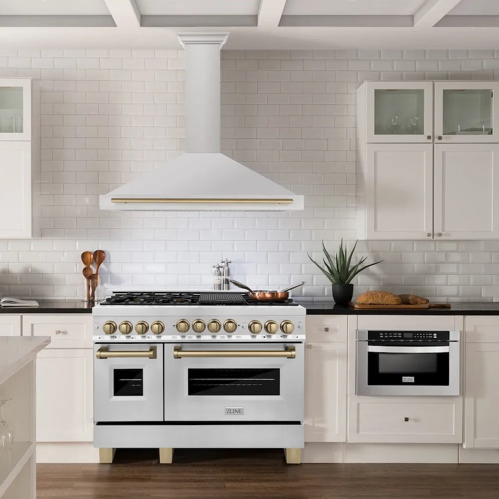 ZLINE Autograph Edition 48 in. Convertible Stainless Steel Range Hood with Stainless Steel Shell and Champagne Bronze Accents (KB4STZ-48-CB) in a luxury kitchen.