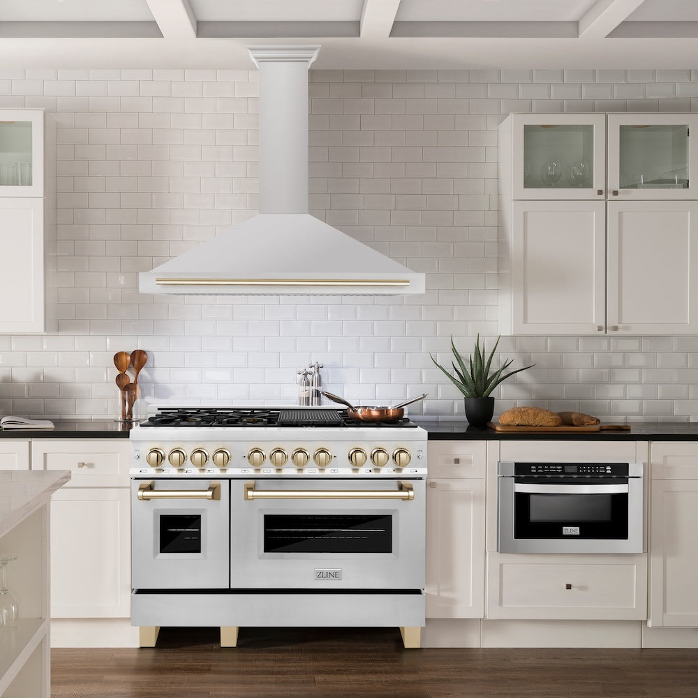 ZLINE Autograph Edition 48 in. Convertible Stainless Steel Range Hood with Stainless Steel Shell and Polished Gold Accents (KB4STZ-48-G) in a luxury kitchen.