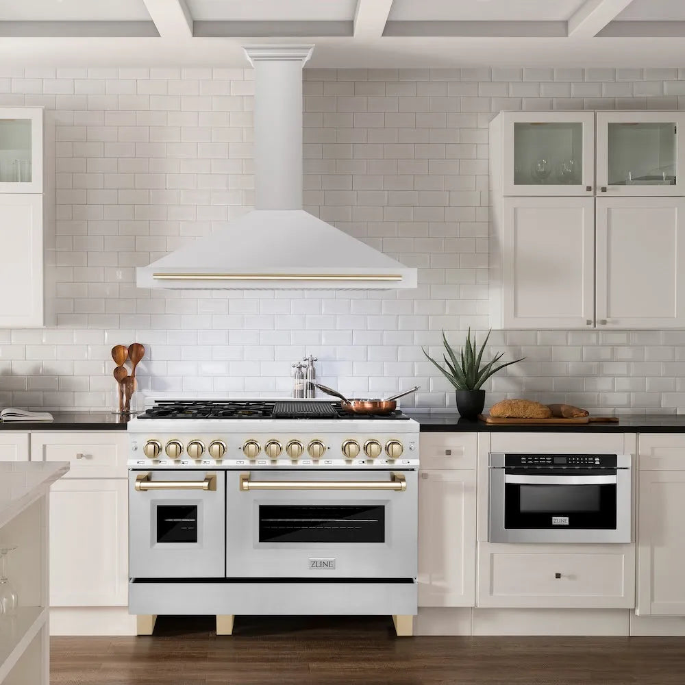 ZLINE Autograph Edition 48 in. Convertible Stainless Steel Range Hood with Stainless Steel Shell and Polished Gold Accents (KB4STZ-48-G) in a luxury kitchen.