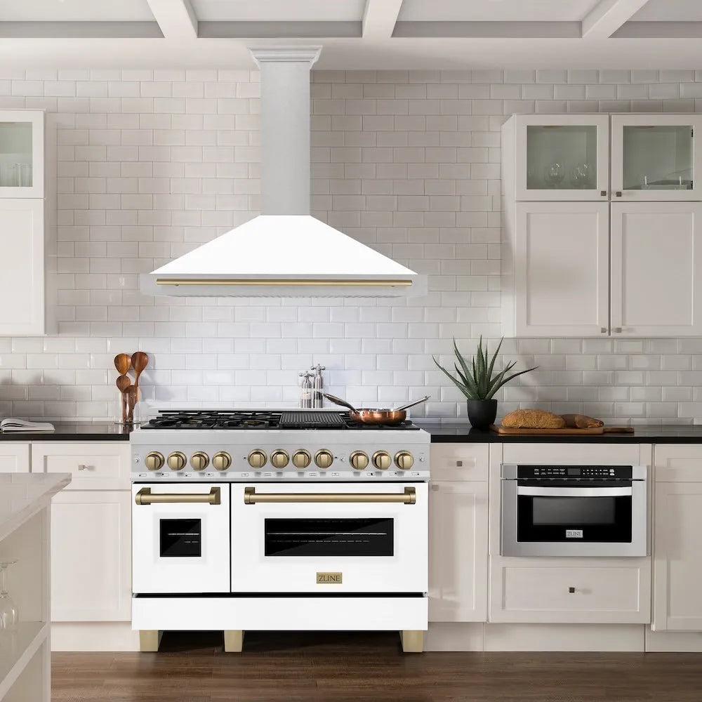 ZLINE Autograph Edition 48 in. Convertible Satin Stainless Steel Wall Mount Range Hood with White Matte Shell and Champagne Bronze Handle (KB4SNZ-WM48-CB) in a luxury kitchen.